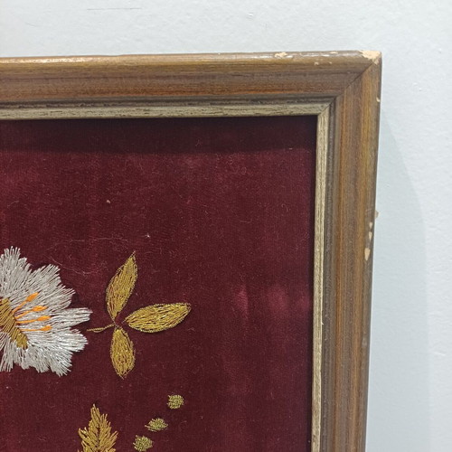 Embroidered textile painting used with gold thread on velvet