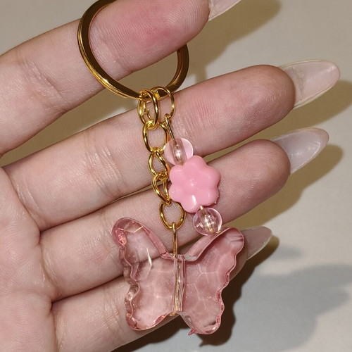 Handmade butterfly keychain in pink and gold stainless steel