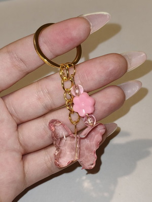 Handmade butterfly keychain in pink and gold stainless steel