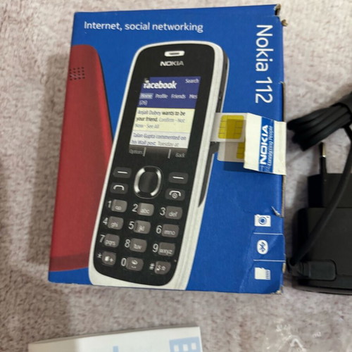 Nokia 112 unused mobile phone in box with battery, charger and headphones
