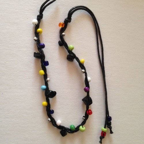 Bracelet used with multicolored beads and black cord
