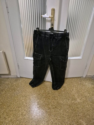 Black pants used with white details, size L