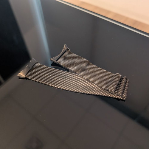Google Pixel Watch 2 with charging base and extra metallic band