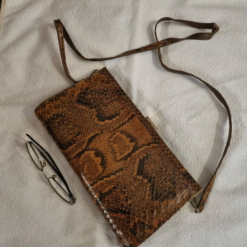 Crossbody bag used with python print leather pattern