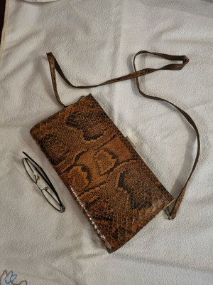 Crossbody bag used with python print leather pattern
