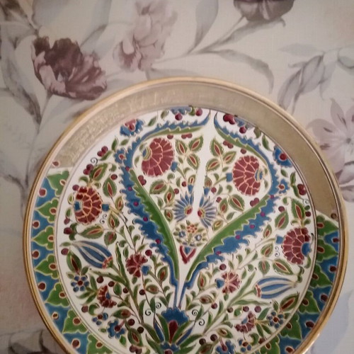 Ceramic wall plate used with gold details