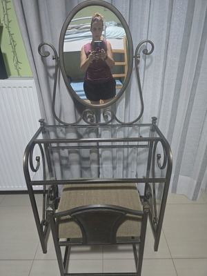 Metal boudoir vanity table with oval swivel mirror and stool