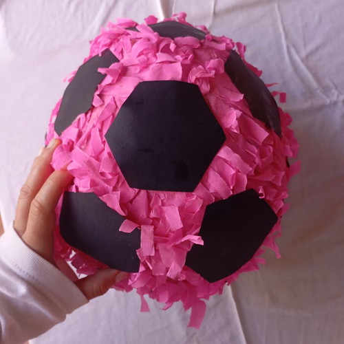 Piñata in the shape of a soccer ball like new, pink and black