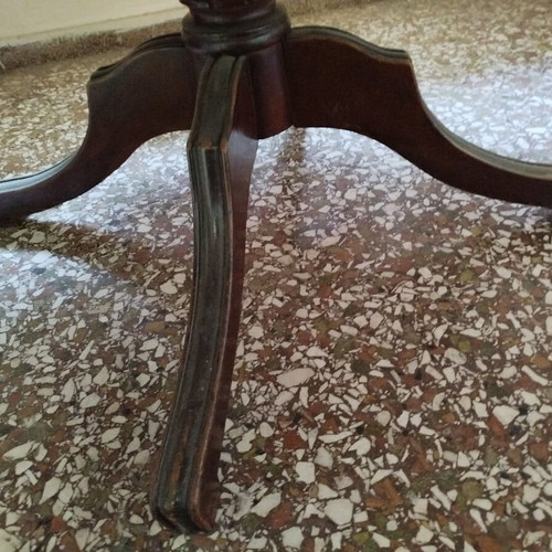 Round table with red tablecloth used, vintage wood design
