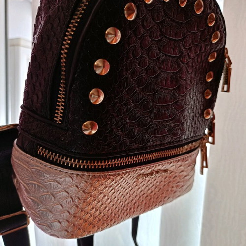 Small backpack like new, black and gold