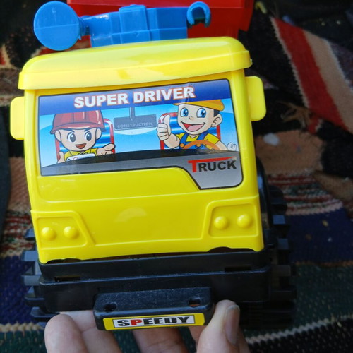 Plastic dump truck used, one horn broken