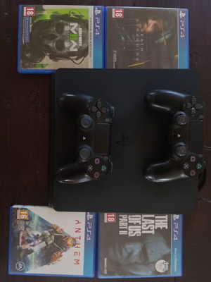 PlayStation 4 Slim 500GB bundle used with 2 DualShock 4 controllers and 4 games