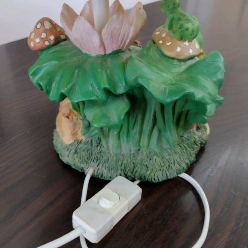 Table lamp used with decorative frog figurines
