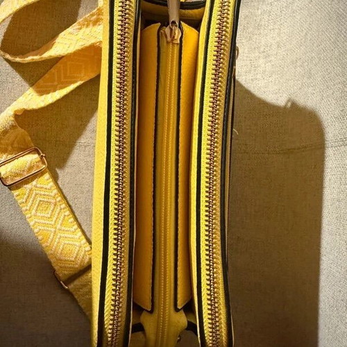 Yellow shoulder bag like new with strap and silver details