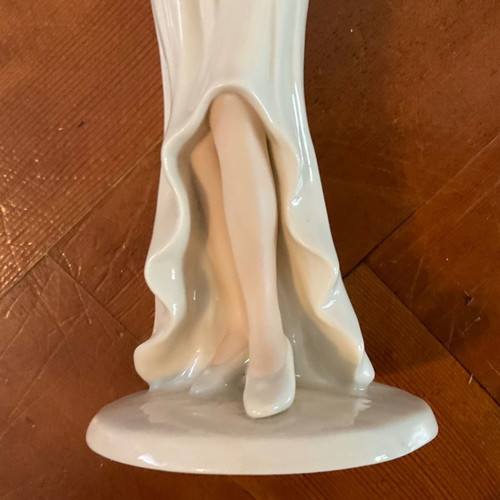 Regal Porcelain Statue