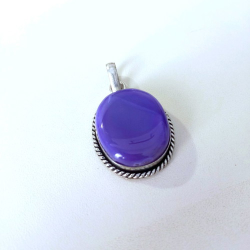 Silver pendant with purple stone used