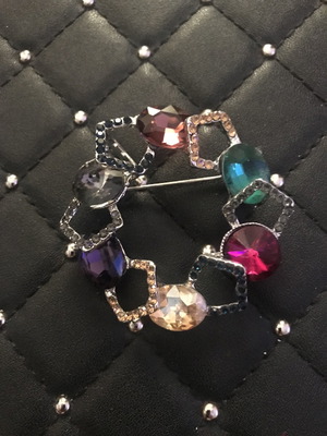 Brooch with multicolored stones
