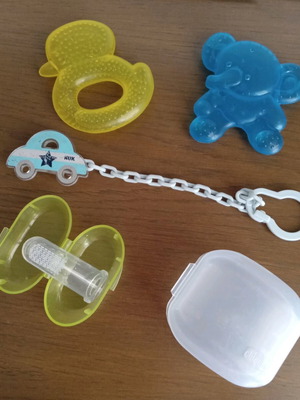 Baby items like new with Chicco pacifier case and teething toys