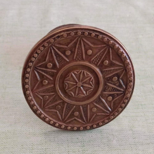 Bronze door knob used with geometric star pattern