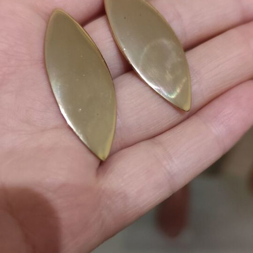 Leaf-shaped earrings used, gold color
