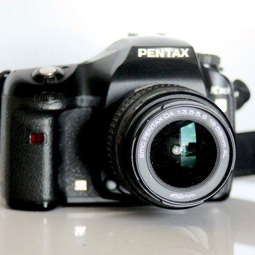 Pentax K10 DSLR camera used with lenses and case