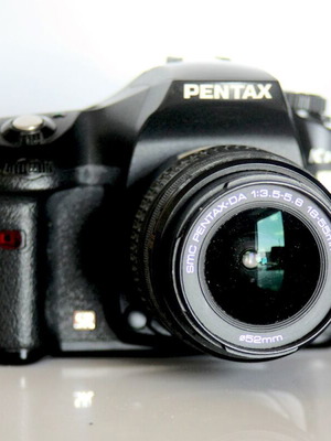 Pentax K10 DSLR camera used with lenses and case