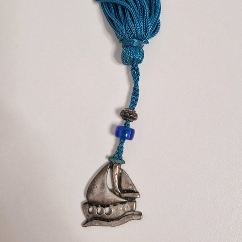 Gouri boat from Mati with blue bead like new