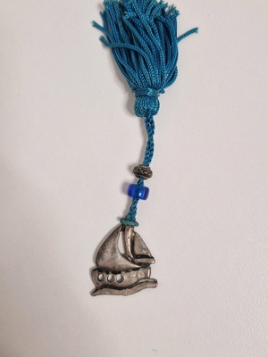 Gouri boat from Mati with blue bead like new
