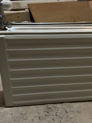 Used two-column radiator 60x40 cm with new switch and metal pipe
