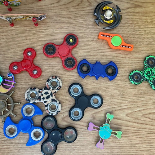 Used toys with figure spinners and skates