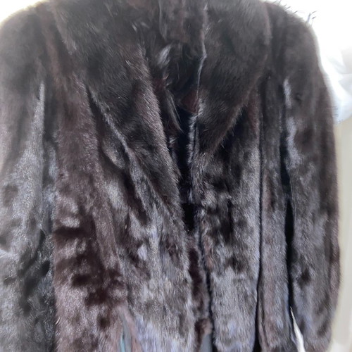 Fur genuine one-piece new, black, with pockets