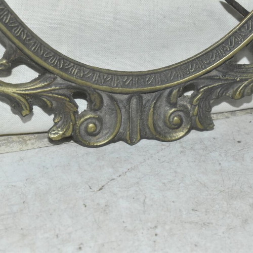 Brass oval frame used with embossed vintage design