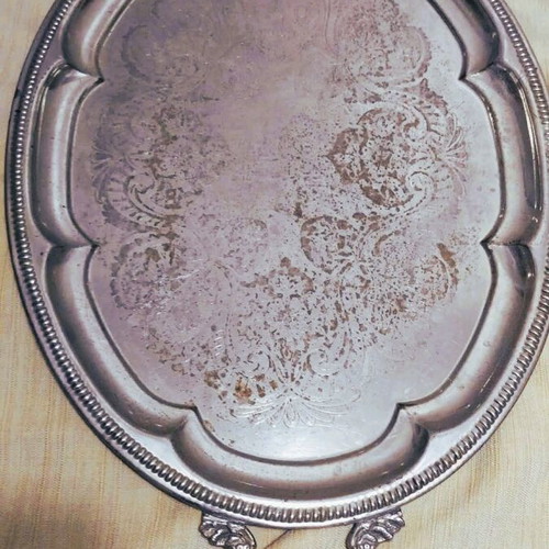 Silver-plated serving tray used with ornate handles