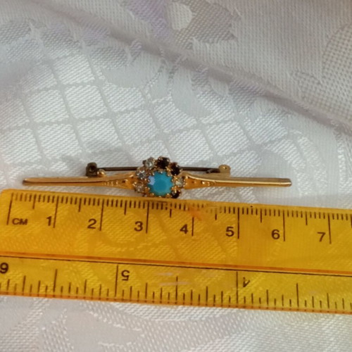 Vintage brooch with zircon and turquoise bead, used