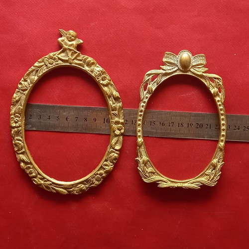Set of two brass frames