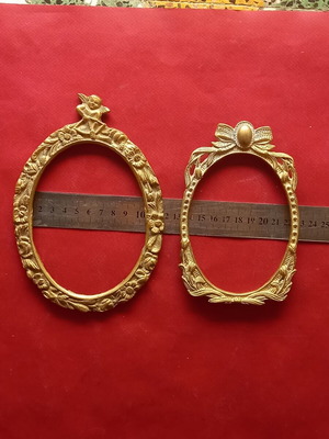 Set of two brass frames