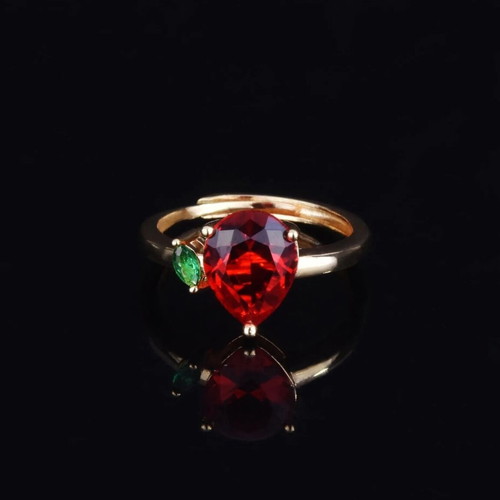 Adjustable ring with red teardrop stone and green detail, gold plated