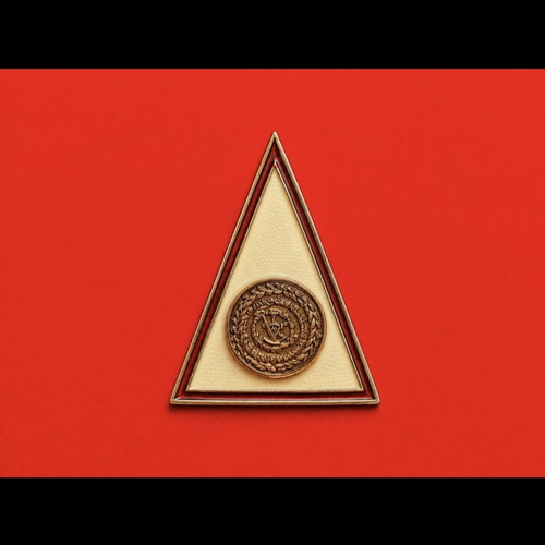 Vintage triangular metal lapel pin with enamel, like new