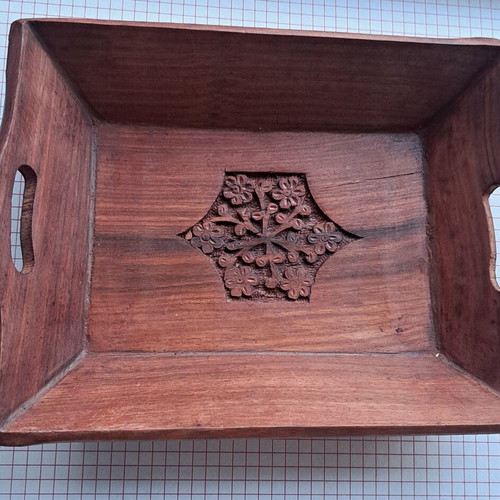 Vintage wooden serving tray used with carved floral motif