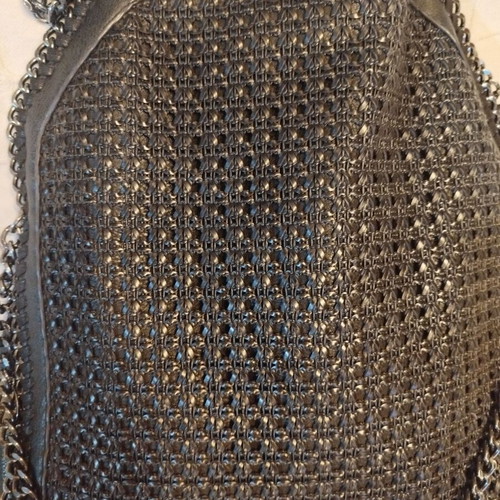 Black shoulder bag like new, synthetic leather with silver chains