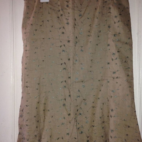 Suit with embroidered floral details like linen used