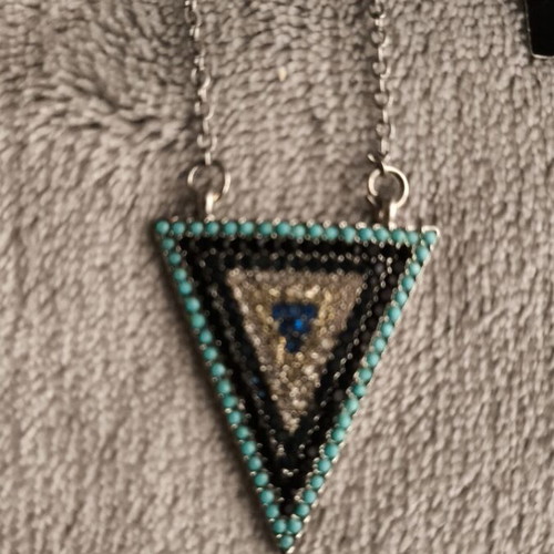 Necklace new with tag, decorated with zircons, blue and silver