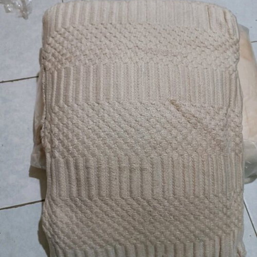 Large handmade beige pillow like new with embossed knitted decoration
