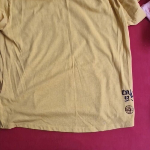 Under Armour T-shirt like new, yellow with logo