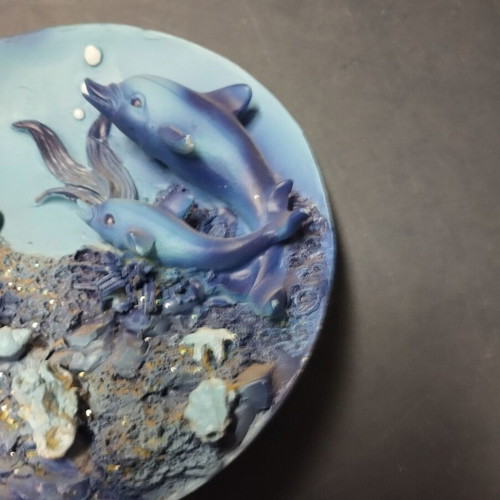 Decorative plate used with dolphins