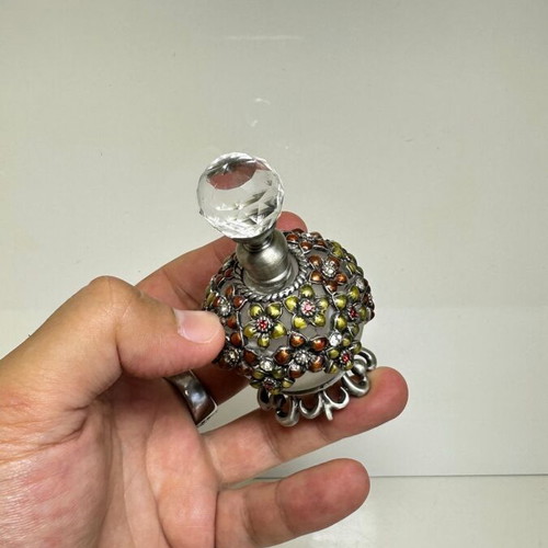 Vintage glass perfume bottle with floral enamel decoration