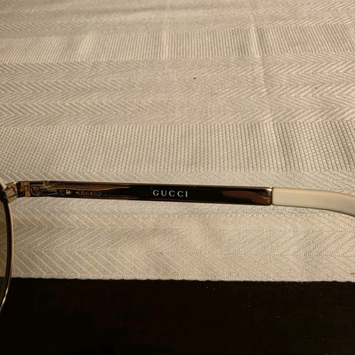 Gucci sunglasses used, white and gold