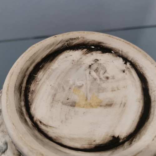 Faience cachepot used with embossed cherub design