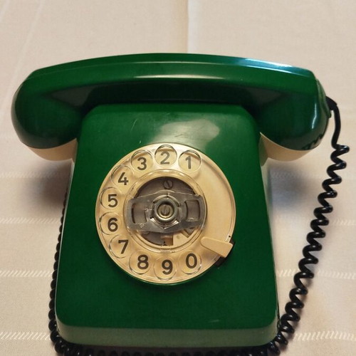 Old green wired telephone, functional