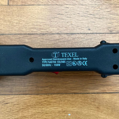 Hair iron used with 3 extra attachments for wavy hair